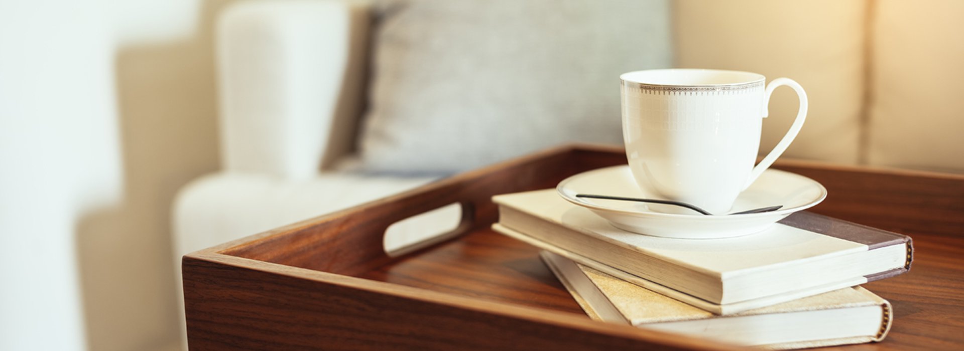 Pillow Sofa Home Interior Coffee cup Books on wooden table